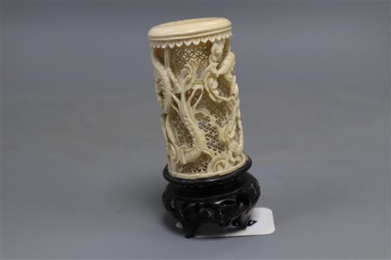 A Chinese carved and pierced ivory dragon vase, wood stand, overall height 11.5cm